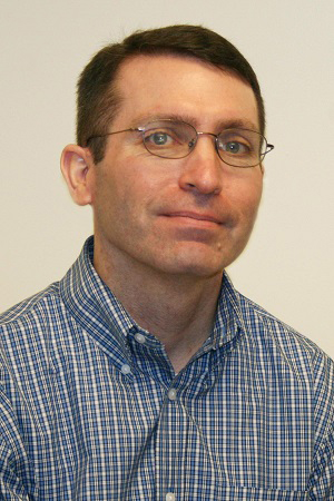 A portrait of associate professor Stephen Walsh.