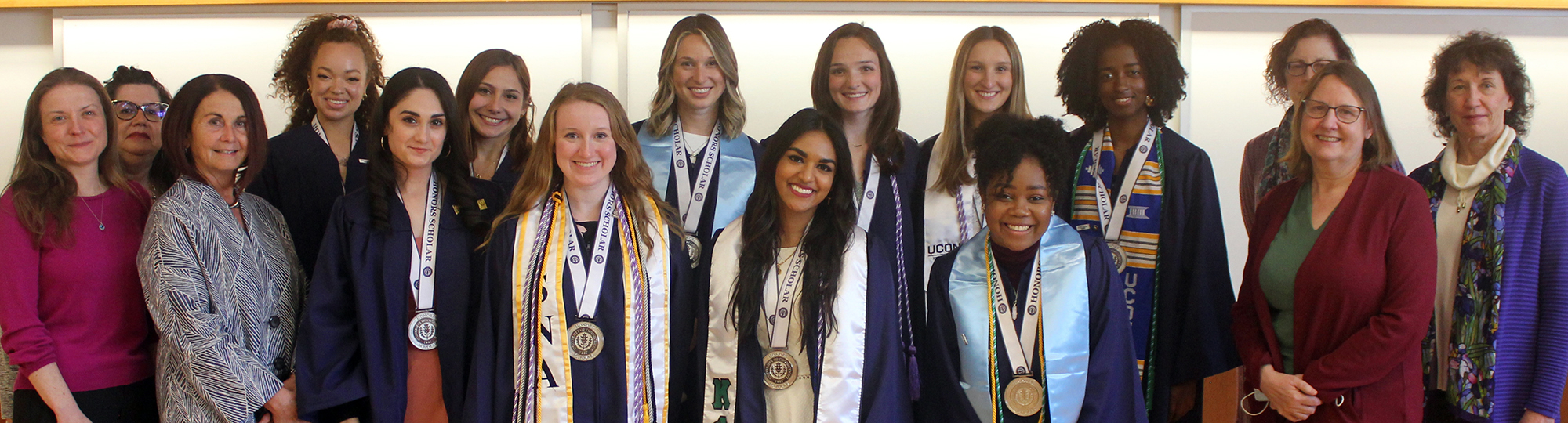 Class of 2022 Honors Program graduates pose with their faculty advisors